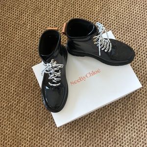 See By Chloe tie up black rain boots with monogrammed shoe laces in black/white